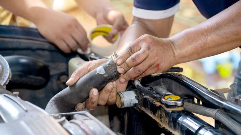 Don't Get Hosed! A Mechanic's Visual Guide to Replacing a Tractor Radiator Hose.